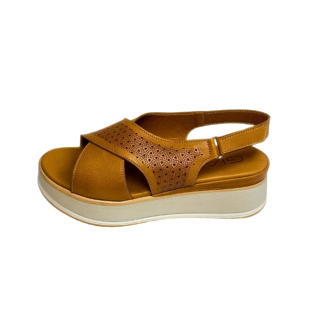 Gia coconut tan leather platform sandals with laser-cut cross-over straps, cushioned insole, slingback strap, and slip-resistant sole – trendy women’s summer sandals with added height.