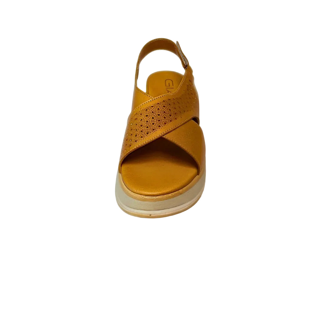 Gia coconut tan leather platform sandals with laser-cut cross-over straps, cushioned insole, slingback strap, and slip-resistant sole – trendy women’s summer sandals with added height.

