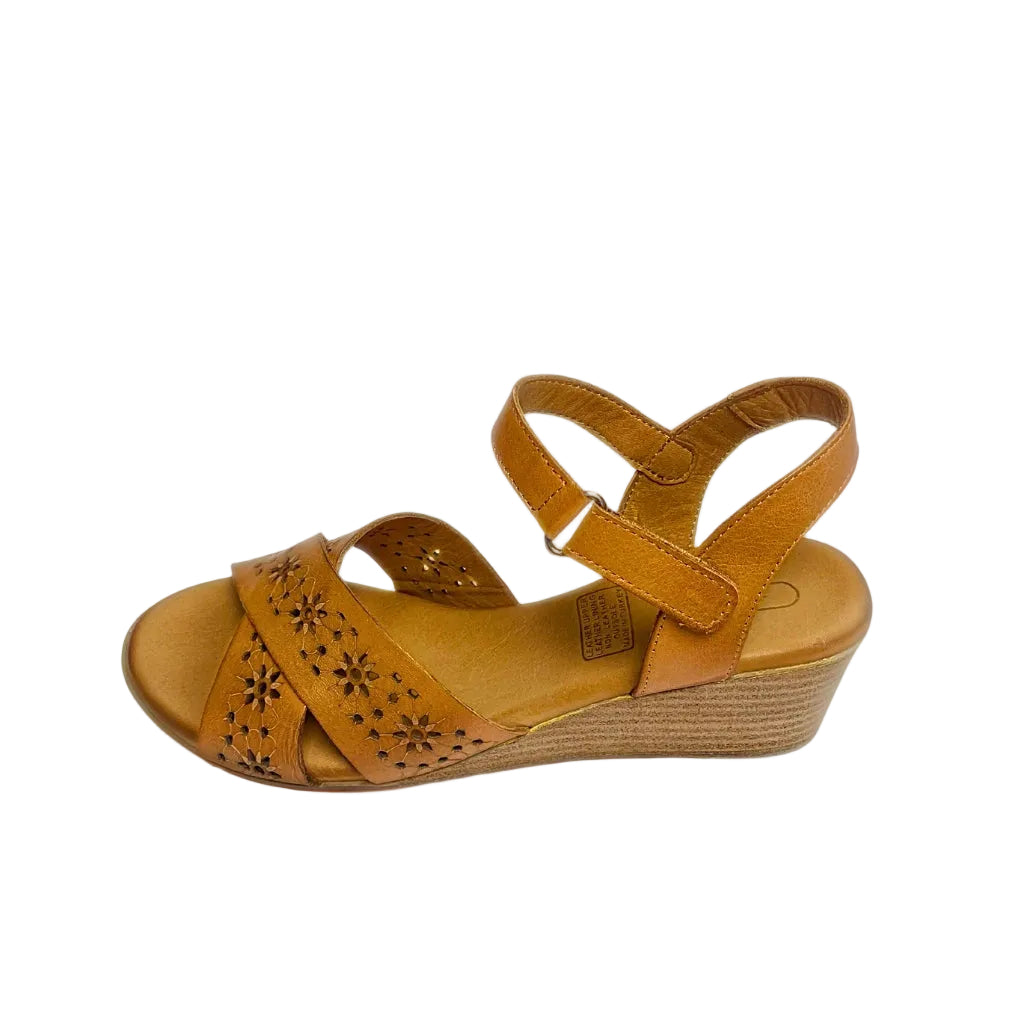 Gia coconut tan leather wedge sandals with floral laser-cut cross-over straps, cushioned insole, ankle strap, and natural wood finish heel – elegant women’s summer wedges for everyday comfort and style.