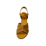 Gia coconut tan leather wedge sandals with floral laser-cut cross-over straps, cushioned insole, ankle strap, and natural wood finish heel – elegant women’s summer wedges for everyday comfort and style.

