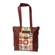 Gia dark red leather tote bag with woven tapestry panel, dual shoulder straps, antique brass hardware, and embossed logo – spacious crochet-inspired handbag for work, travel, and everyday wear.
