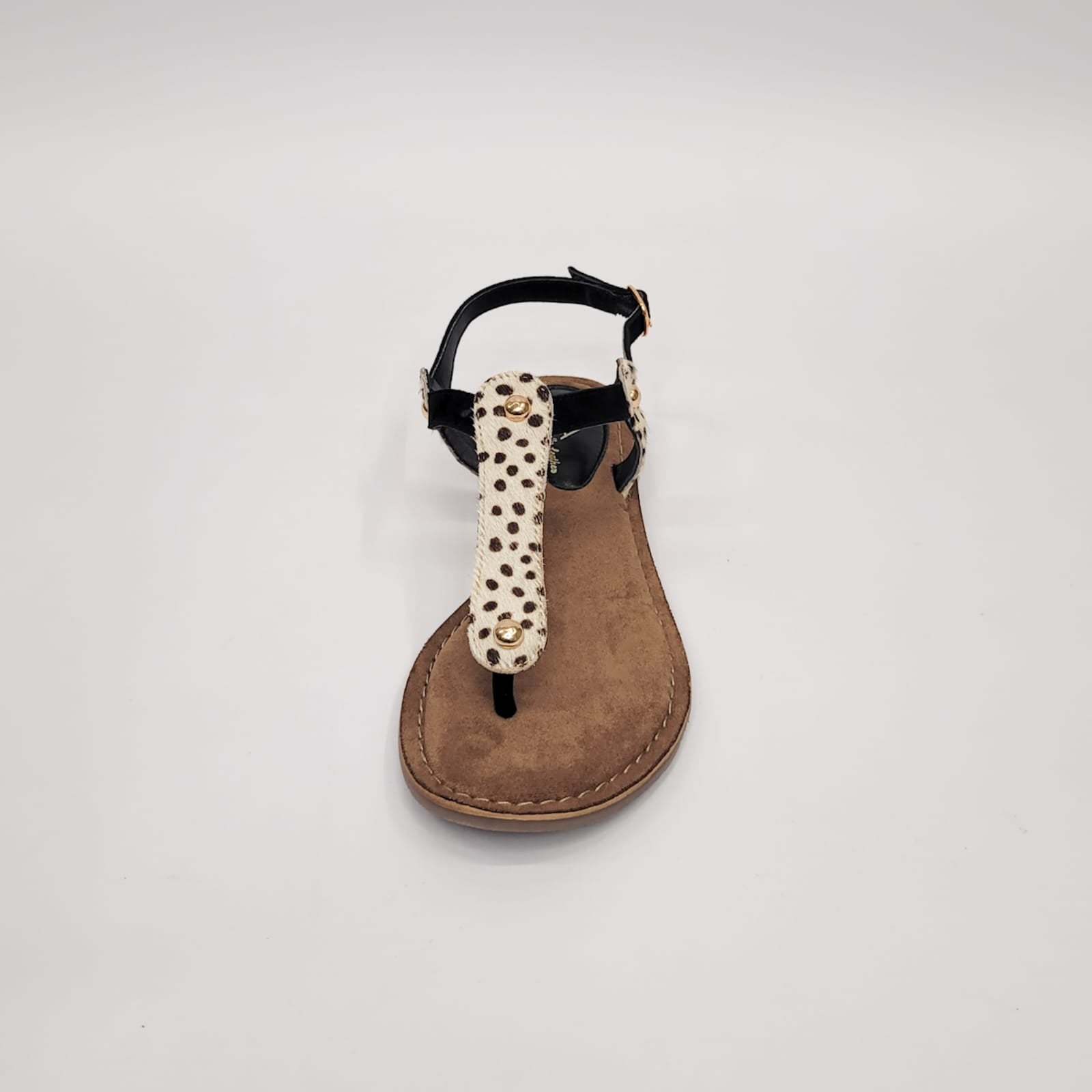 Gia leather sandal with black and dalmatian-patterned toe thong strap, adjustable strap, crafted in India, perfect for stylish and comfortable summer wear. 4