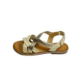 Gia off-white and gold leather criss cross slingback sandals with cushioned insole, adjustable strap, and flexible sole – elegant women’s summer footwear for comfort and style.