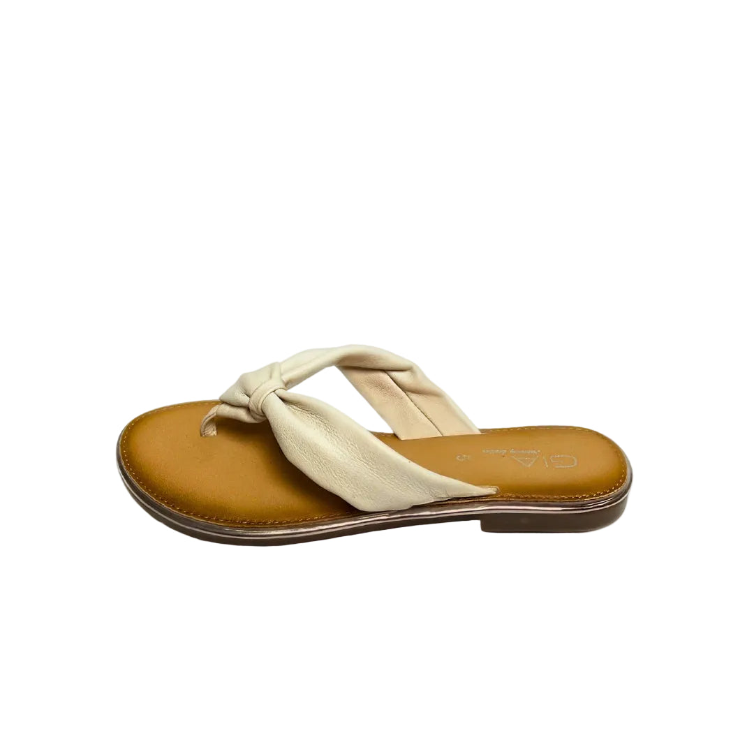 Gia white leather knot sandals with cushioned insole, slip-on design, and knotted strap detail – chic women’s summer footwear for casual wear, holidays, and resort style.