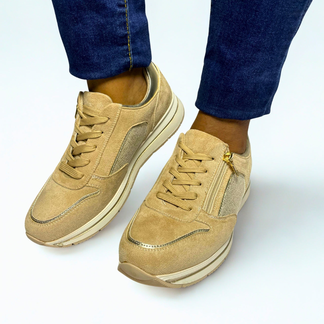 Jumbo beige lace-up sneaker with side zip, gold accents, and cushioned sole for casual comfort.