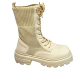 Plum beige combat-style boot with ribbed knit shaft, chunky lug sole, and lace-up front. 