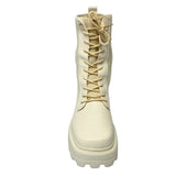 Plum beige combat-style boot with ribbed knit shaft, chunky lug sole, and lace-up front.