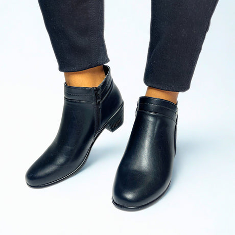 Black ankle boot with low block heel, tapered toe, side zip, and silver stud detail — perfect for smart-casual wear.
