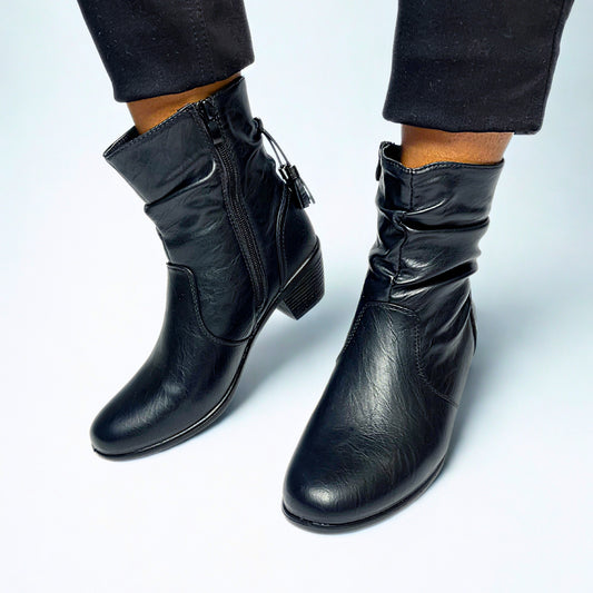 Black mid-calf boot with ruched faux leather, side tassel zip, and low block heel for stylish everyday wear.

