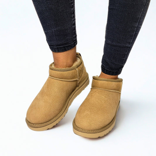  UGG Classic Ultra Mini sand sheepskin boots with 3.5" shaft, water-repellent suede, and sugarcane EVA outsole 1
