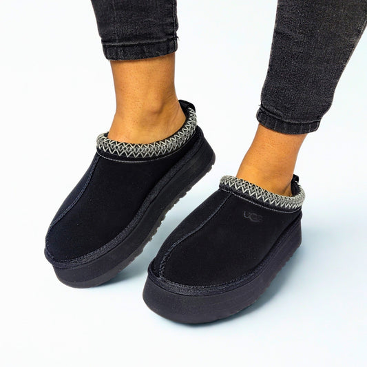  UGG Tazz black suede platform boots with sheepskin lining, UGGbraid detail, and sugarcane EVA outsole 1