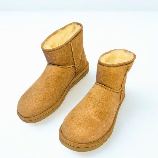  UGG men's Classic Mini chestnut boot with sheepskin lining and Treadlite sole. 1