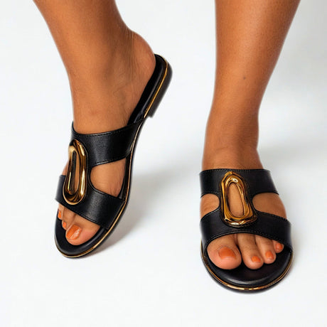 Gia Black Leather Slide With Gold Accent on foot