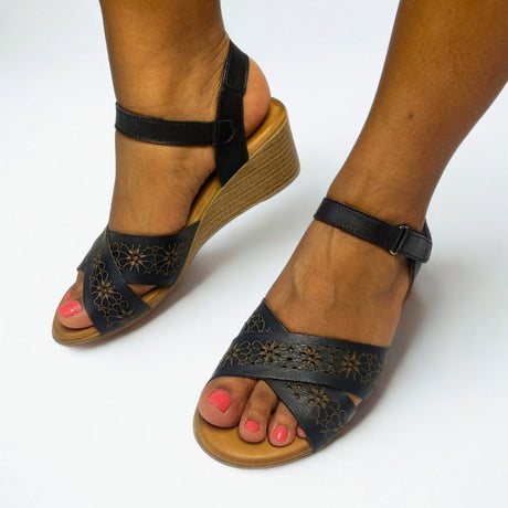 Gia Black Laser Cut Leather Wedge on foot