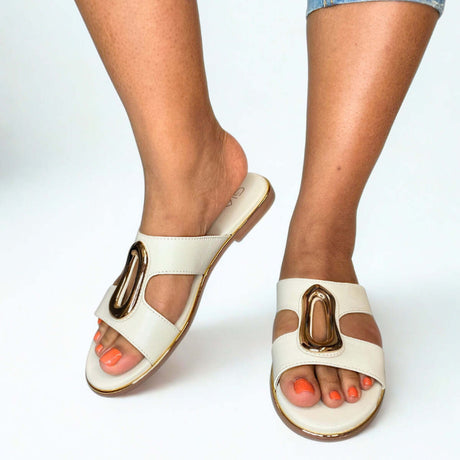 GIA bone leather slides with gold accent worn on model