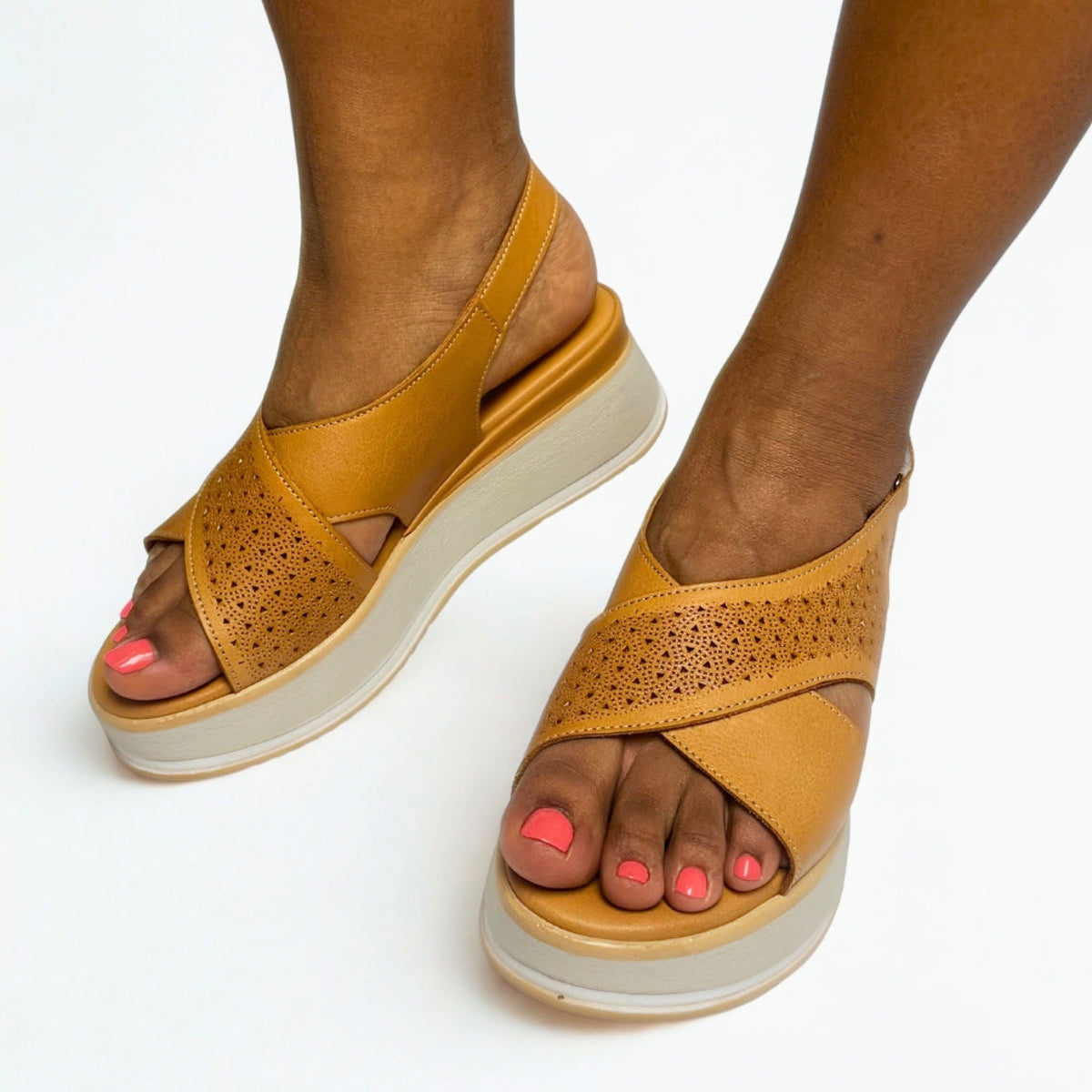 GIA laser cut platform sandals in coconut worn on model