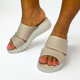 GIA perforated flatform sandals in stone worn on model